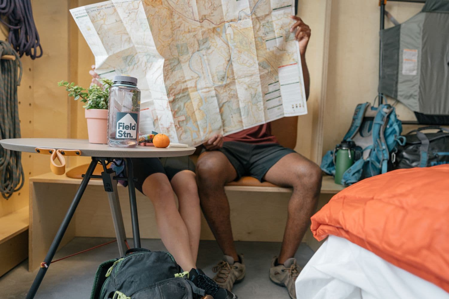 two people sitting down looking at a map
