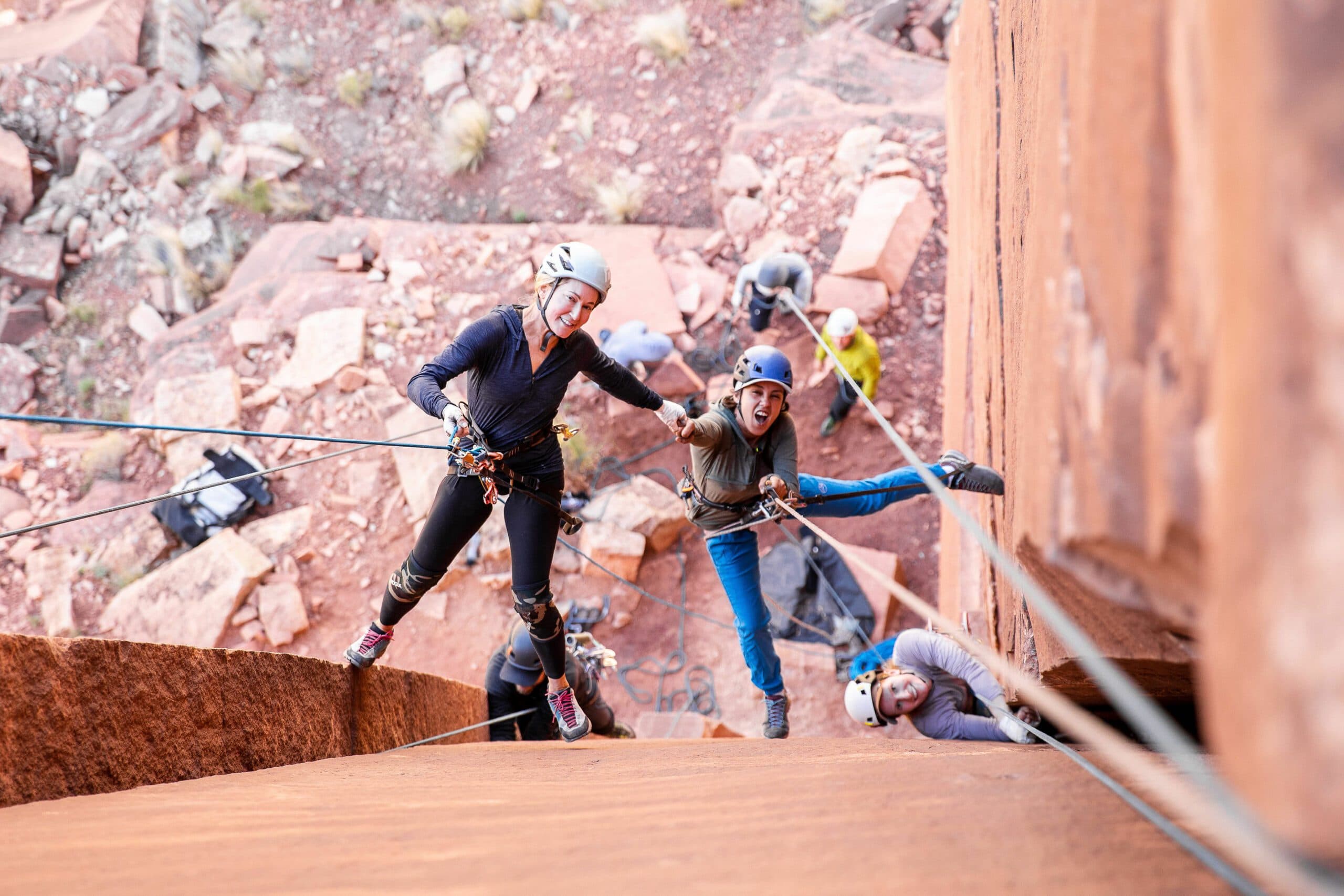 people rock climbing