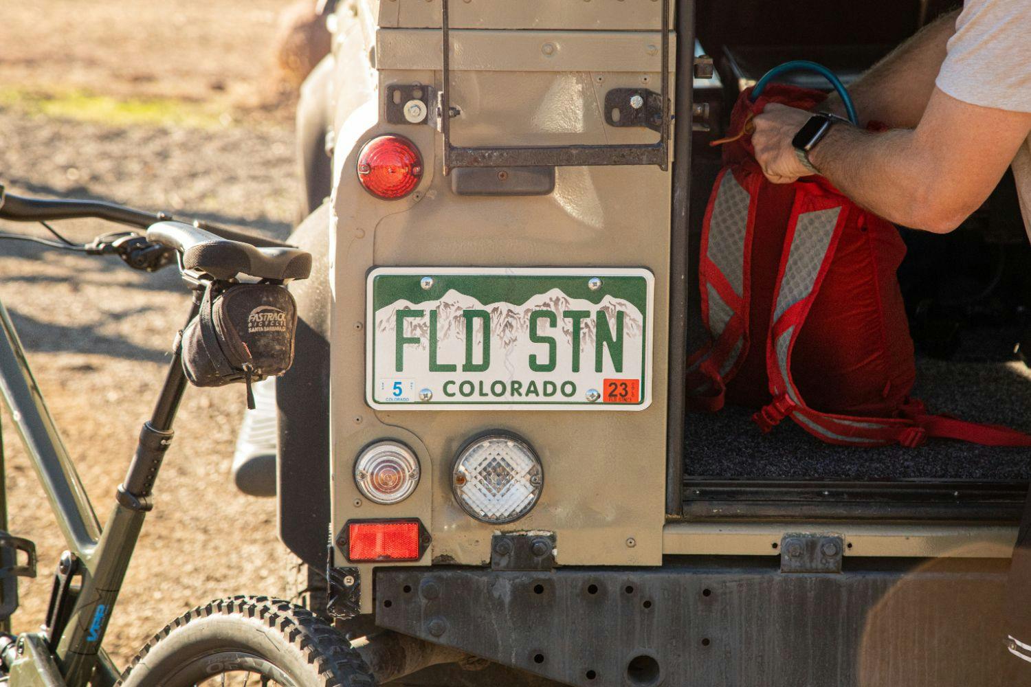 Field Station Colorado license plate on a jeep
