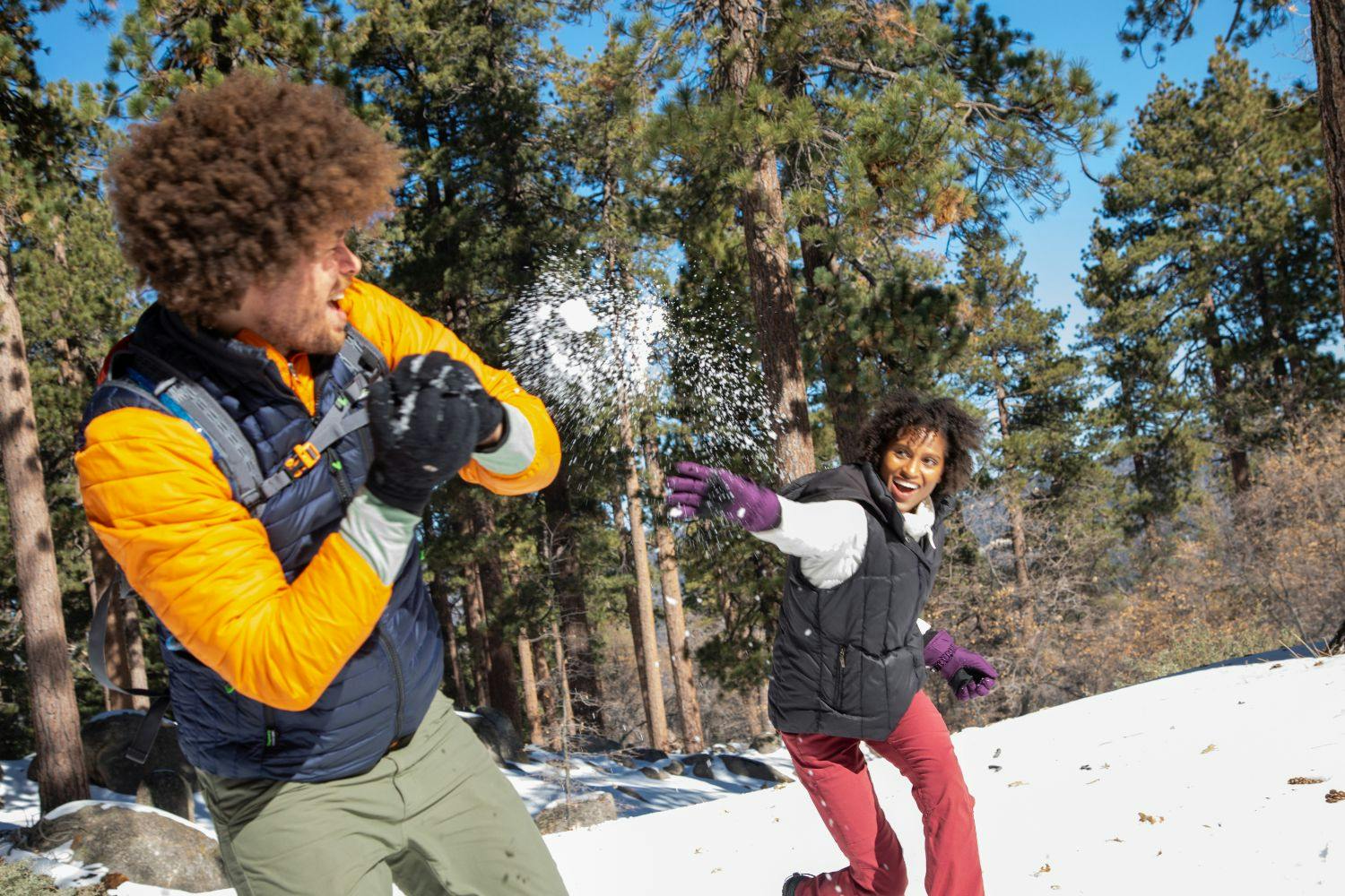 two people having a snowball fight