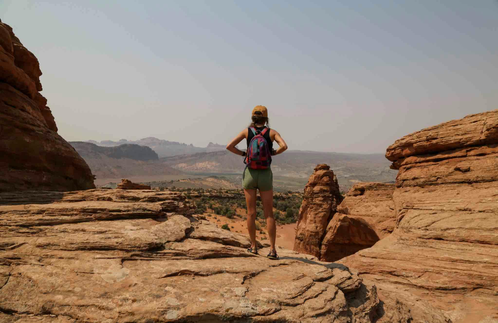 A woman hiker looking across a canyon